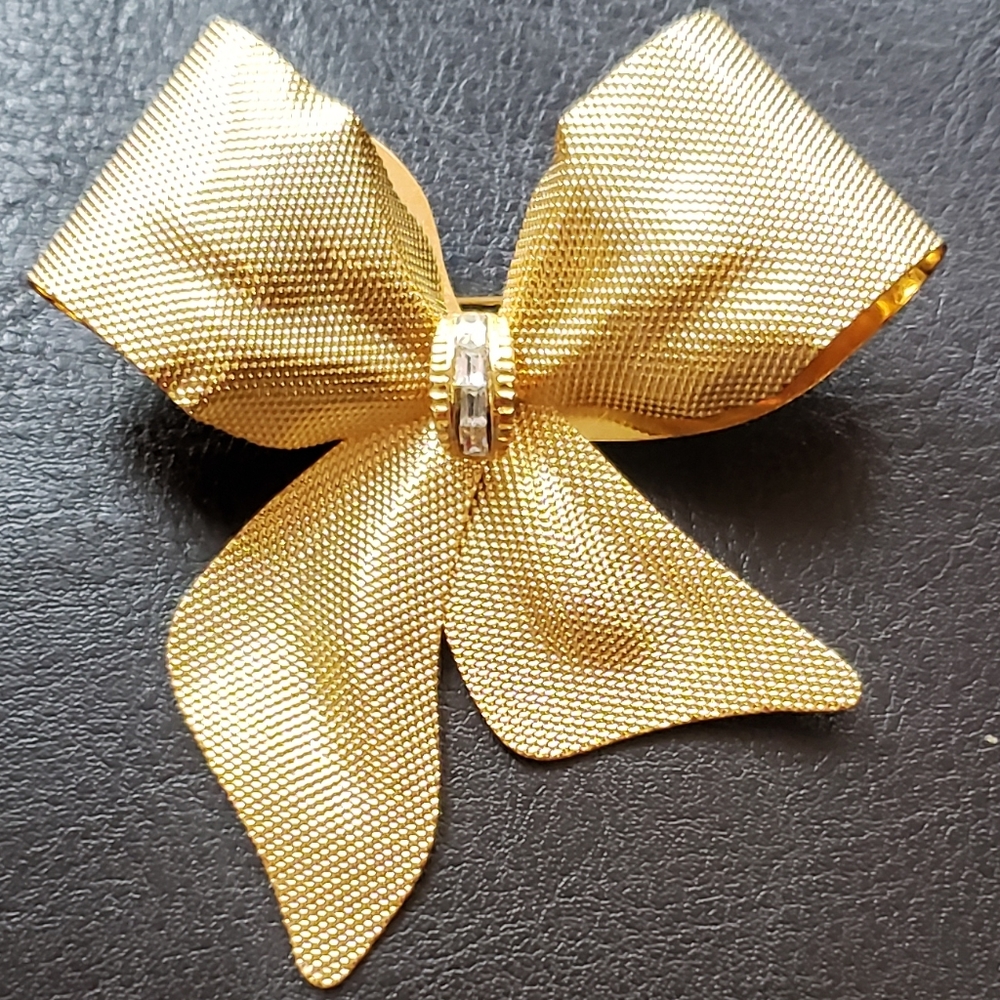 Gold tone Bow brooch with rhinestones